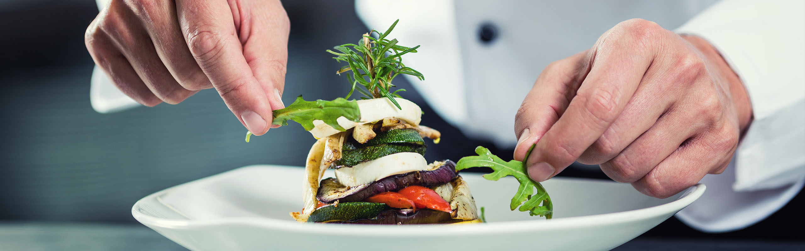 A chef plating up