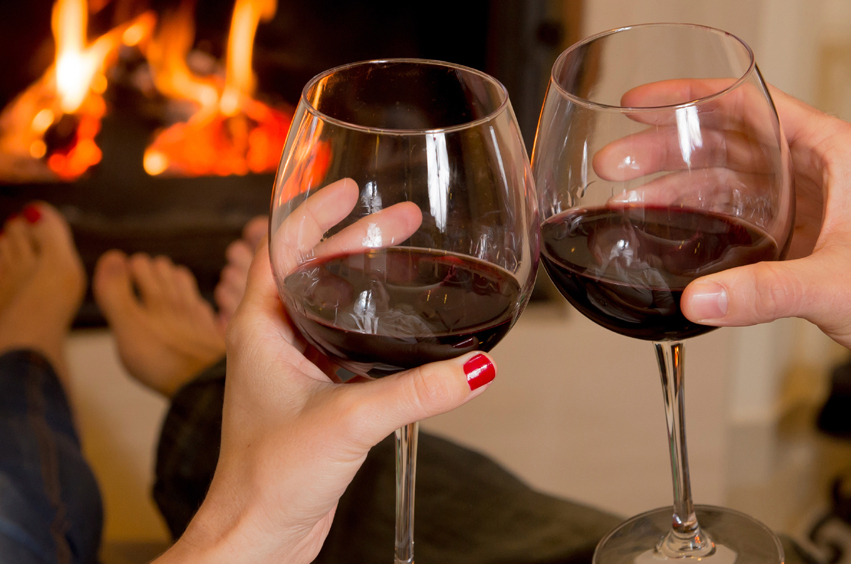 A photo of a couple toasting a drink