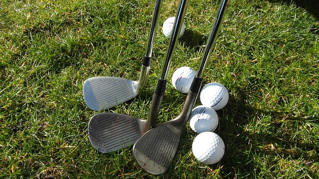 A photo of some golf balls and clubs