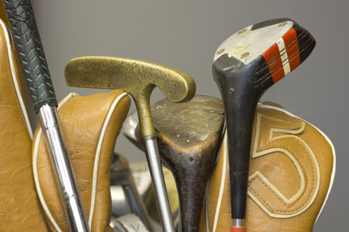 Close up of some old golf clubs
