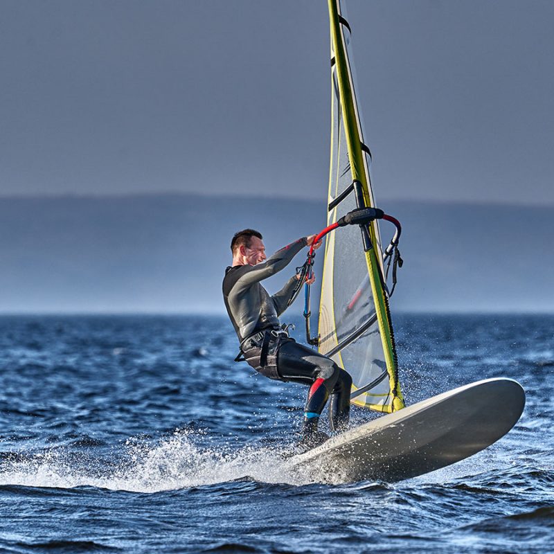 A person wind surfing