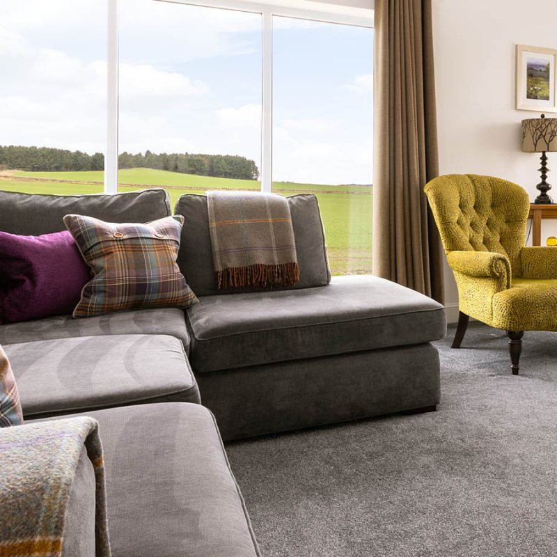 The lounge seating are in Lodge 1 with its beautiful countryside view at Elderburn Luxury Lodges