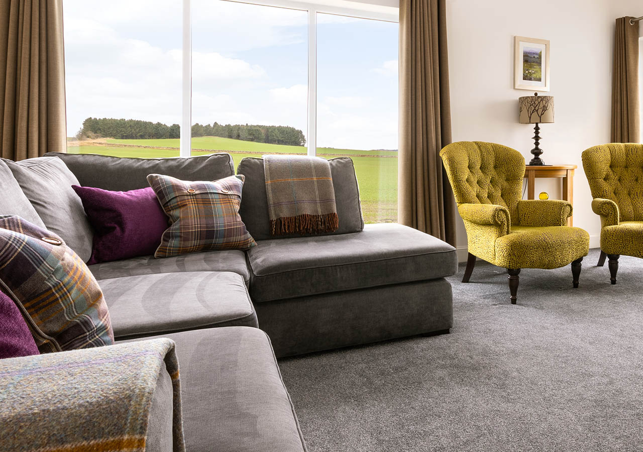 The lounge seating are in Lodge 1 with its beautiful countryside view at Elderburn Luxury Lodges