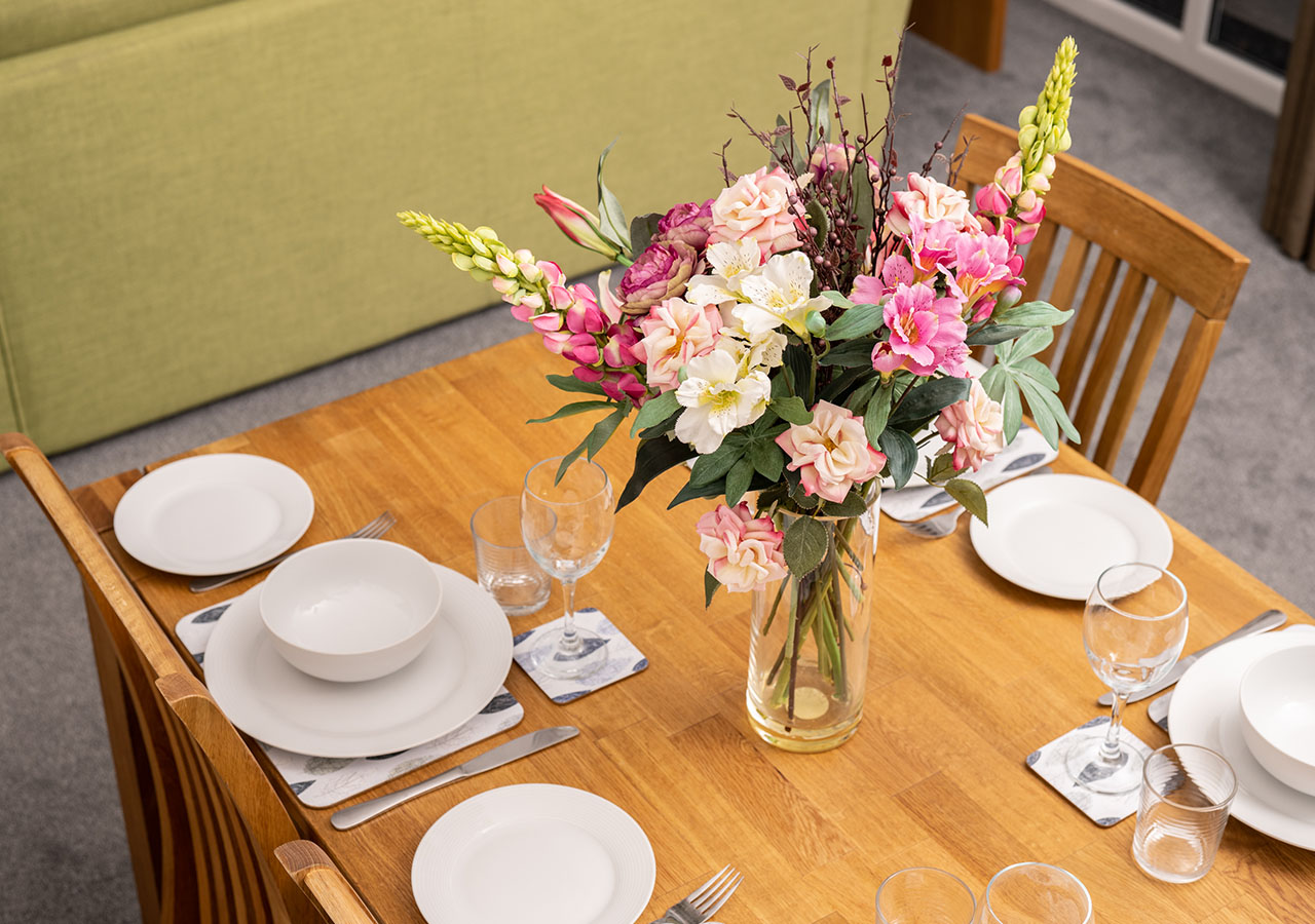 A table set for dining in Lodge 2 at Elderburn Luxury Lodges