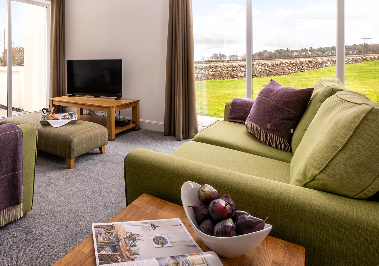 Lodge 2 seating in the living room with countryside views at Elderburn Luxury Lodges