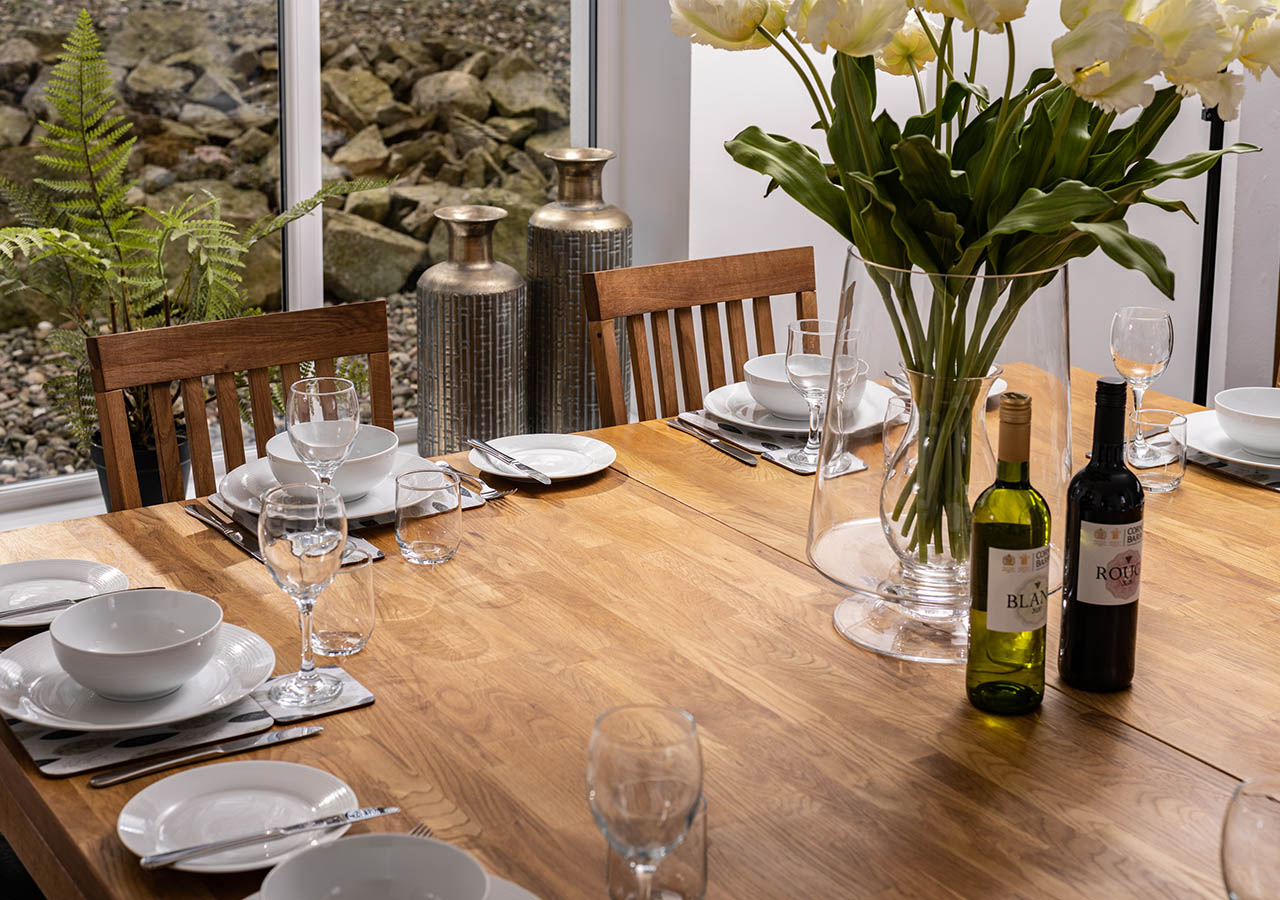 A table set for dining in Lodge 6 at Elderburn Luxury Lodges