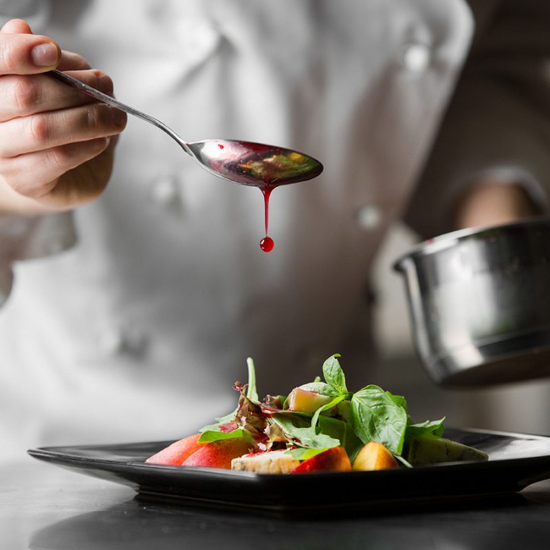 A chef plating up