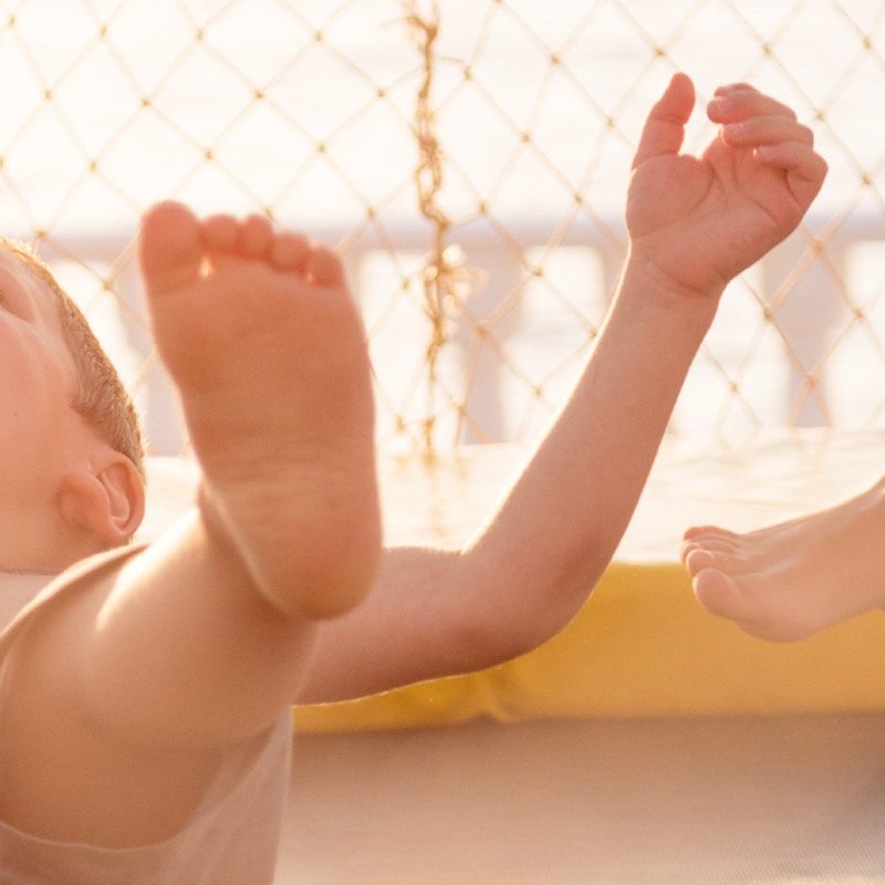 Happy child bouncing on a trampoline