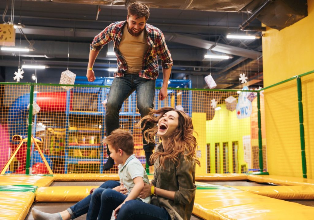 Family having a fun day out on a trampoline