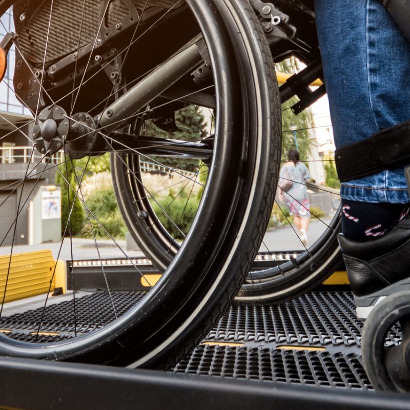 Man in a Wheelchair on taxi lift