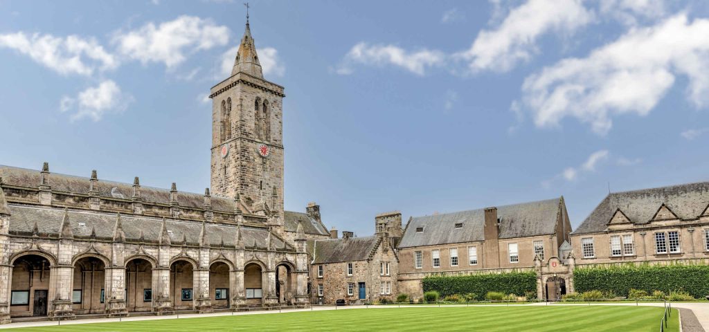 The iconic buildings and grass fields of the quadrangle at the University of St Andrews in Scotland
