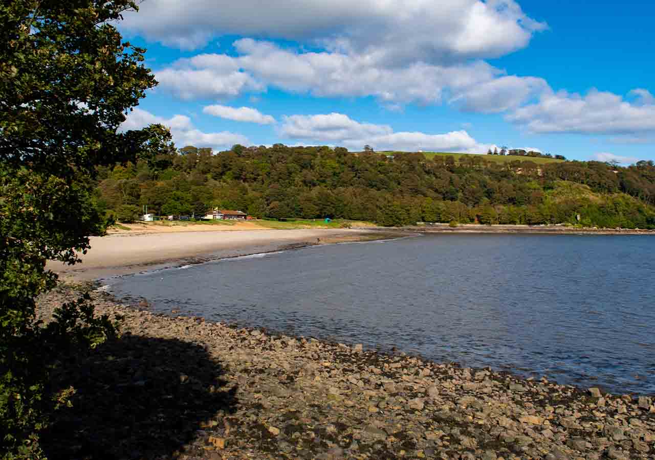 The curving Aberdour Silversands Beach.