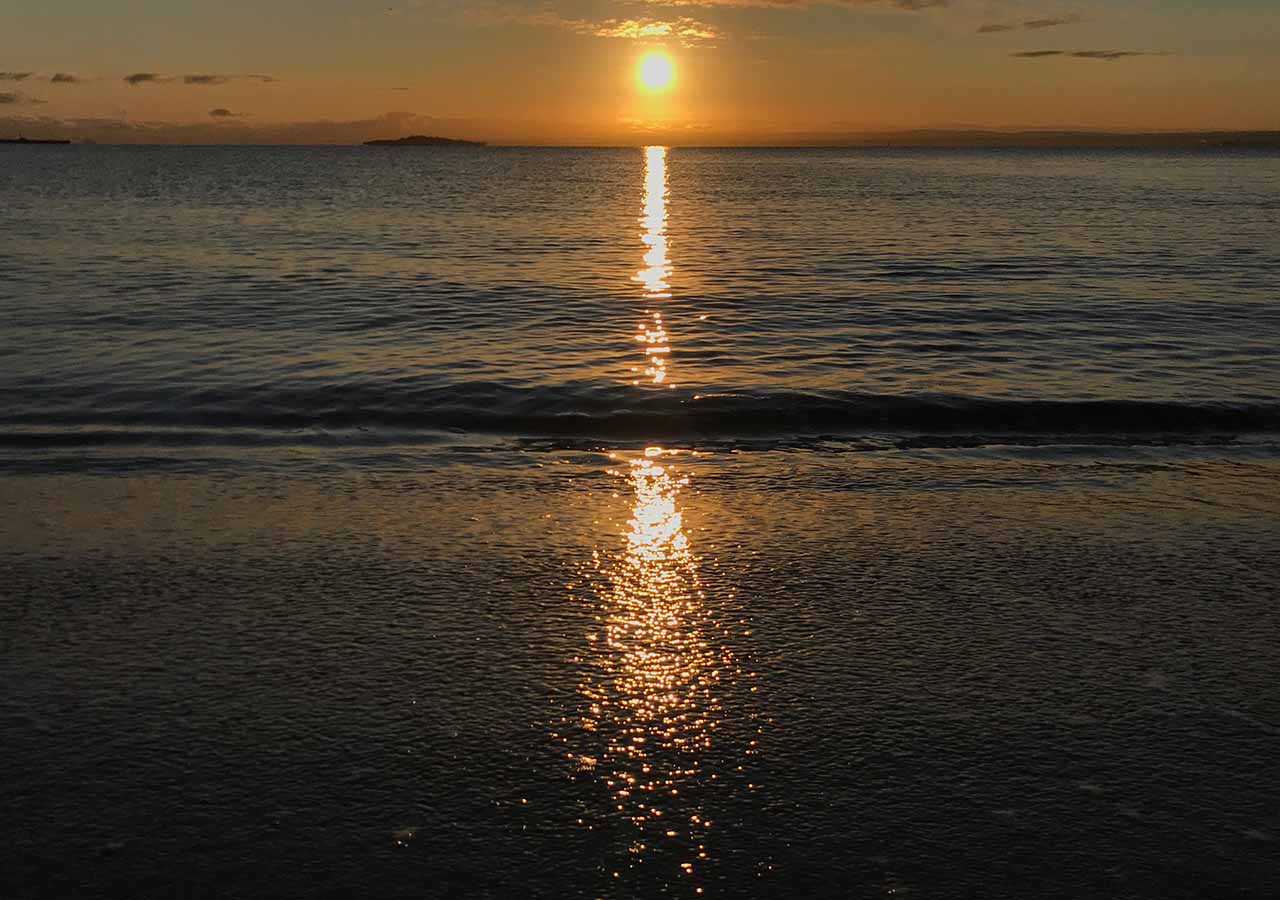Sunset over water at Aberdour Silversands.