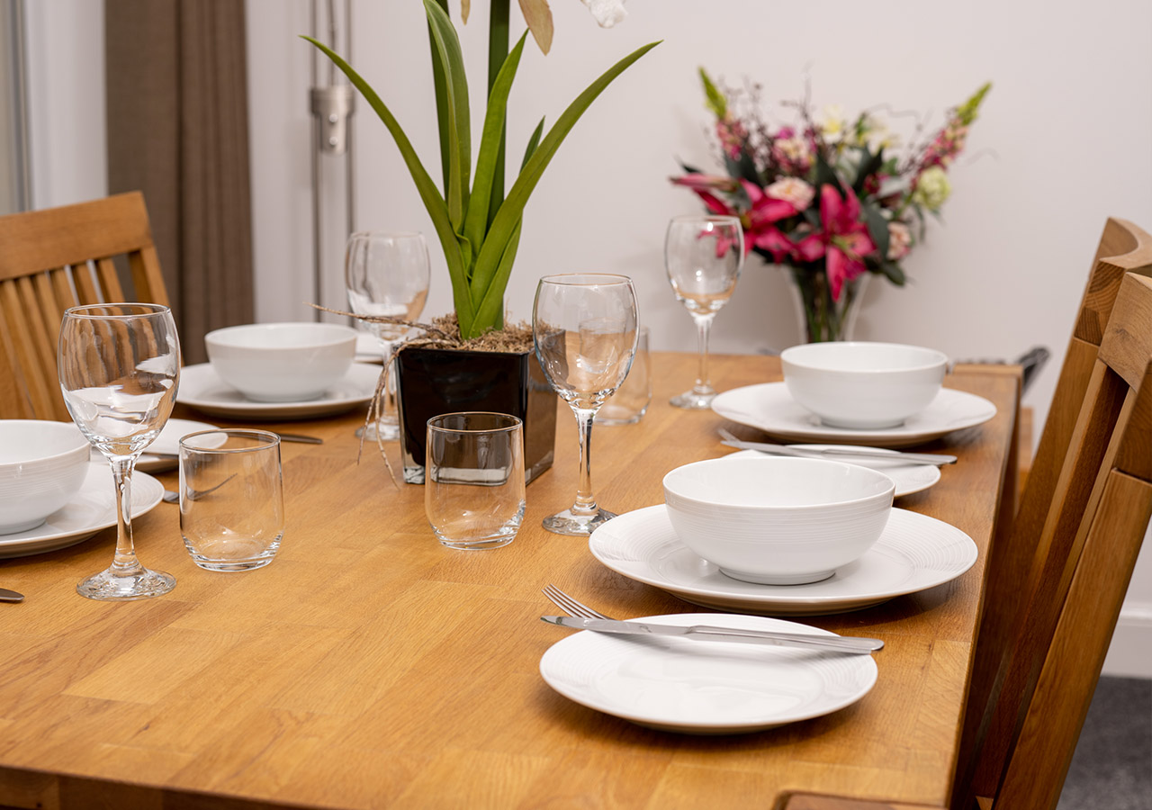 A table set for dining in Lodge 1 at Elderburn Luxury Lodges